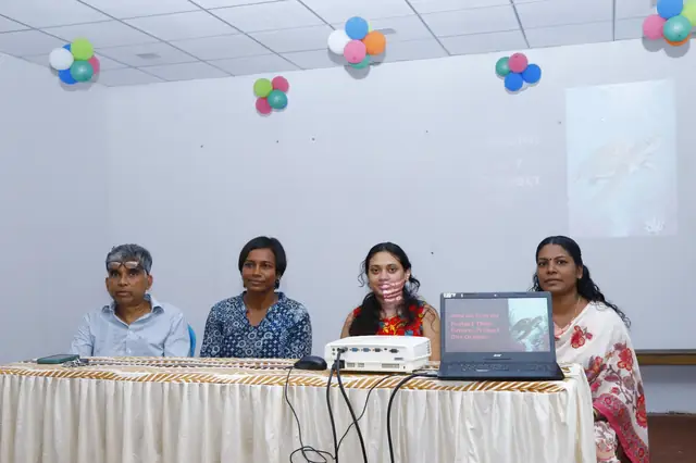 Panel of speakers with a sea turtle presentation